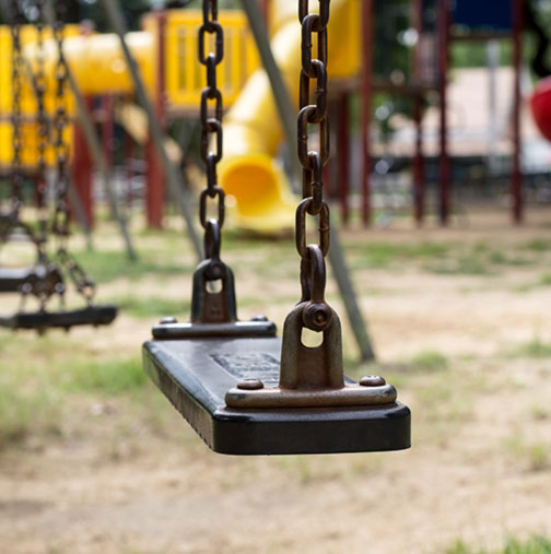 empty swings on playground