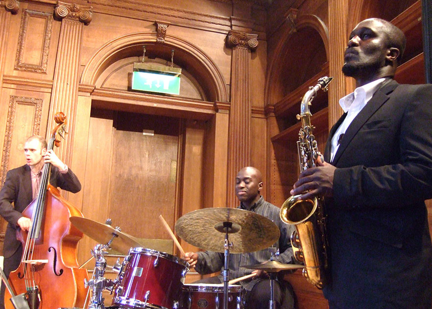 3 of the 4 members of the Tony Kofi Quartet (L-R: Ben Hazleton, Winston Clifford and Tony Kofi. (Photo: Andy Newcombe on Flickr) 3 of the 4 members of the Tony Kofi Quartet (L-R: Ben Hazleton, Winston Clifford and Tony Kofi. (Photo: Andy Newcombe on Flickr)