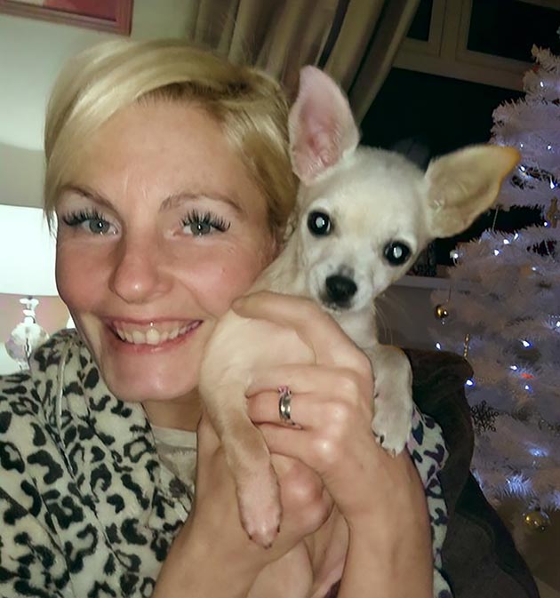 TESS ROBISON is seen with Lola, who detected her cancer. 